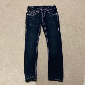 Women size 28 low rise, skinny Jean in color blackish navy. True Religion